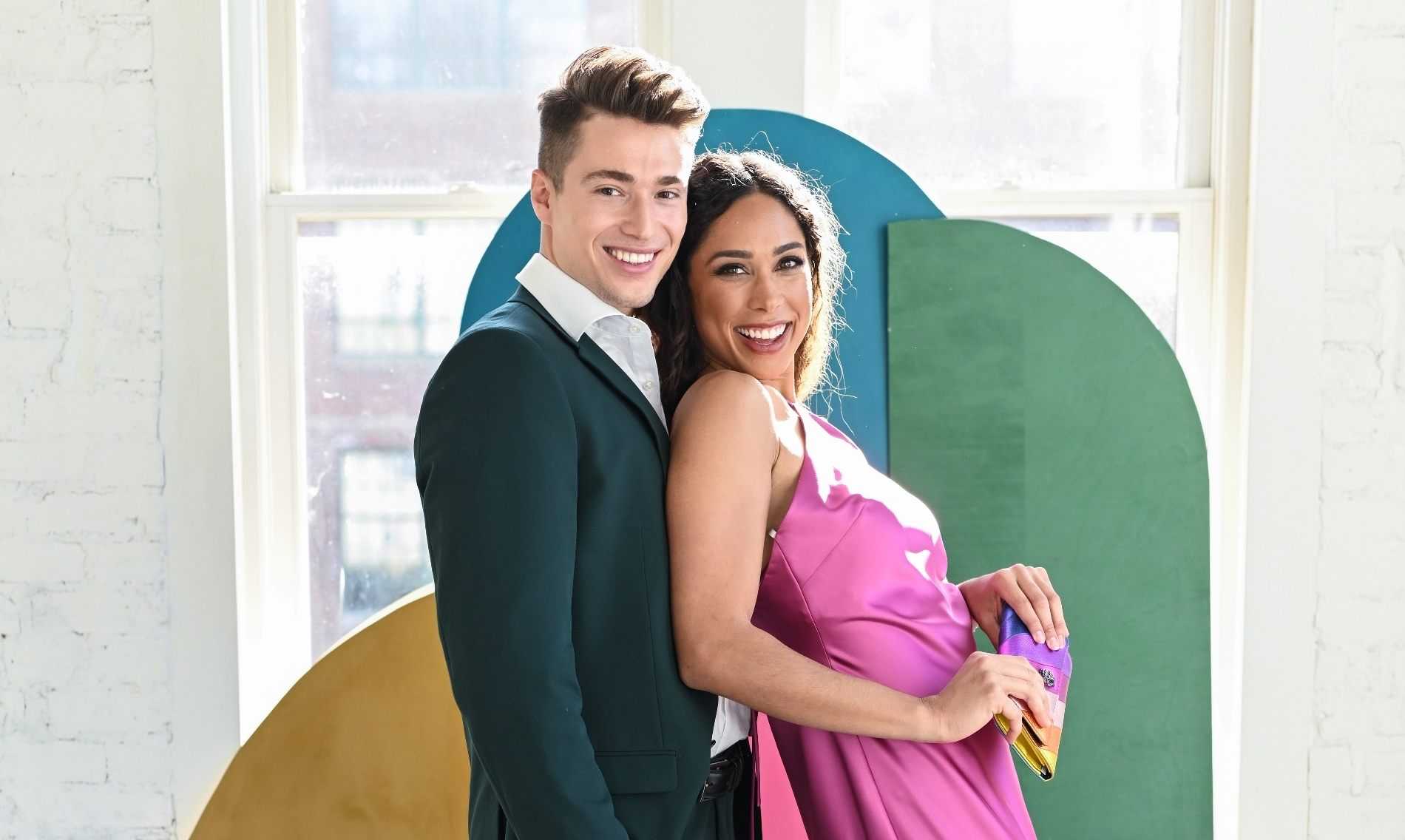 Bright prom date outfits with pink satin prom dress & dark hunter green prom suits for men.
