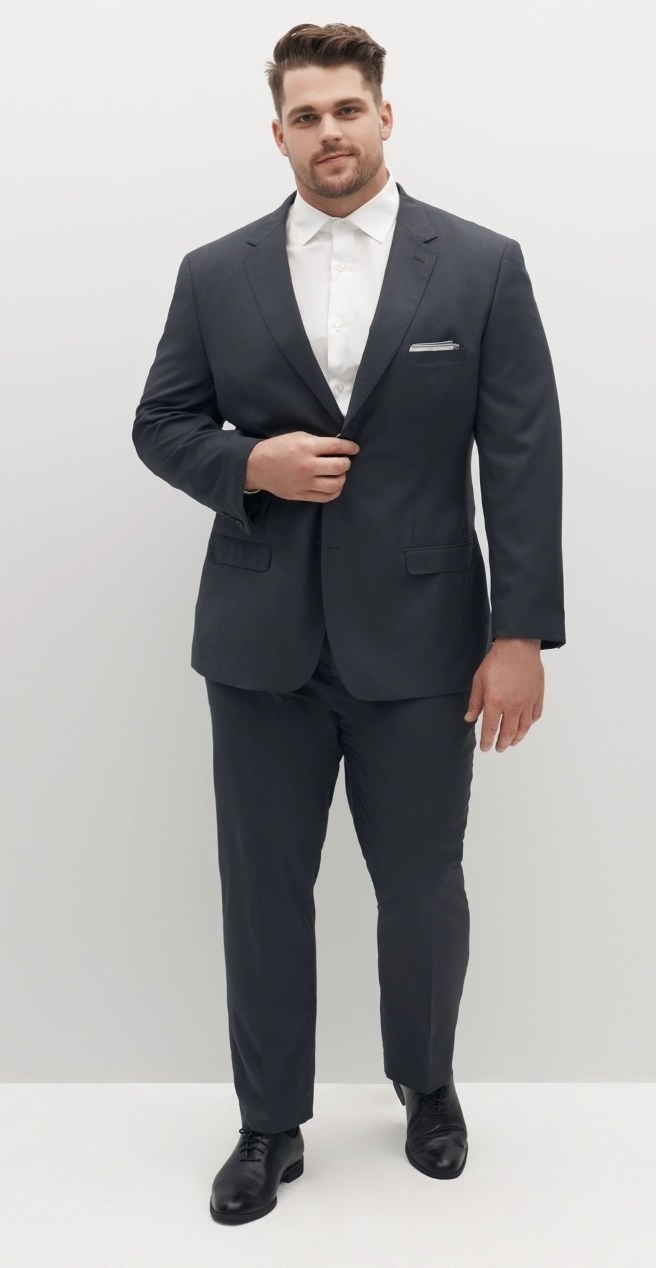 Big and tall men's suit in dark grey with the perfect fit onthick, athletic man.
